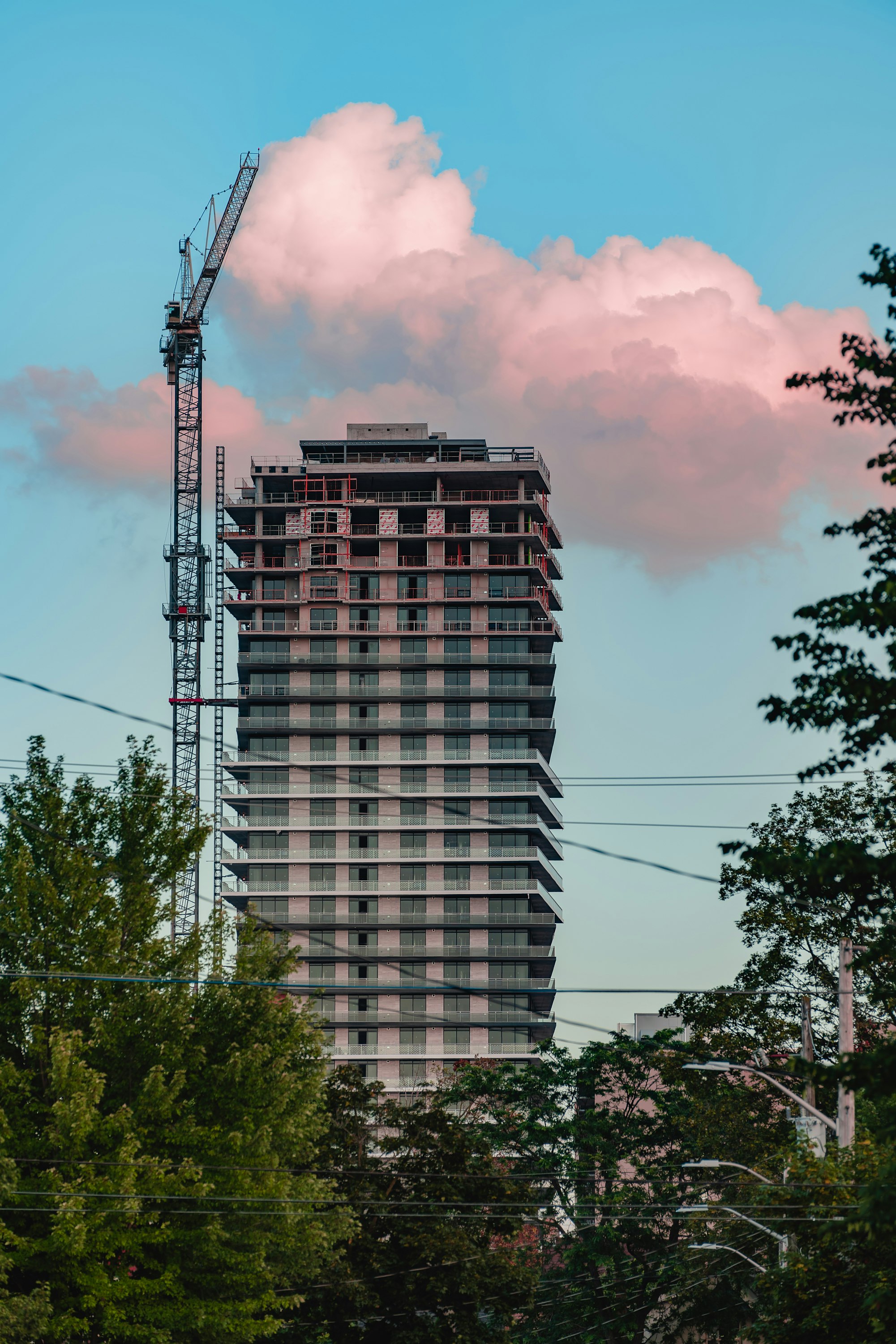 black high rise building under cloudy sky during daytime